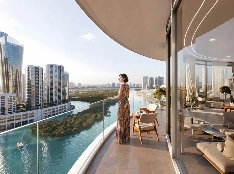 Resident on a curved balcony at Waterfront by Missoni overlooking the Reem Island canal and mangroves