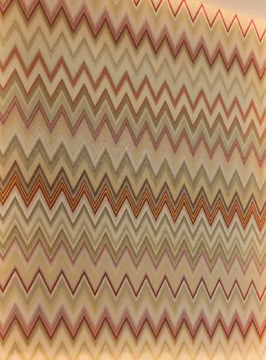Close-up of the Missoni zigzag panel behind the bed in a Waterfront by Missoni bedroom